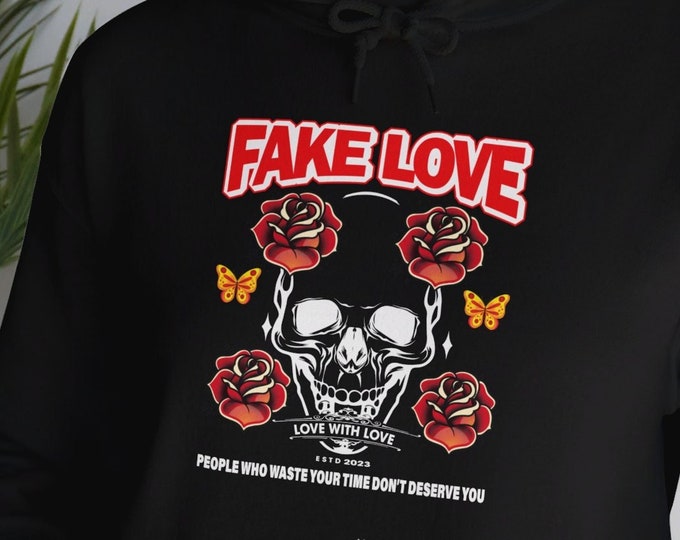 Fun and Stylish Fake Love Graphic Tee, Unisex Sizing | Unisex Heavy Blend™ Hooded Sweatshirt