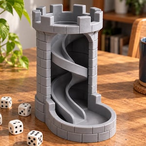 May include: A gray dice tower shaped like a castle turret with a crenelated top and an internal spiral ramp that leads to a base tray. Five white six-sided dice with black pips are positioned on the surface near the base of the tower structure.