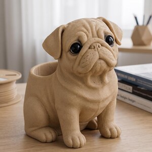 May include: A tan-colored pug-shaped desk organizer or planter featuring a detailed, textured surface, large dark eyes, and a hollow opening on the back. The dog is depicted in a seated position with its head tilted slightly, showcasing realistic facial folds.