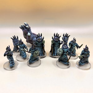 May include: A set of 9 painted miniature figures, including a large, multi-eyed, clawed hand, and 8 smaller figures with multiple eyes, robes, and weapons. The figures are painted in shades of purple, blue, and green.