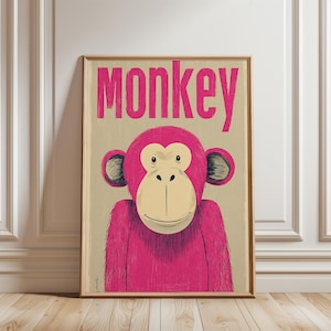 May include: A framed wall art print featuring a stylized illustration of a monkey with bright pink fur and a cream-colored face. The word "monkey" is printed in large, bold pink letters at the top of the beige background, creating a graphic design.