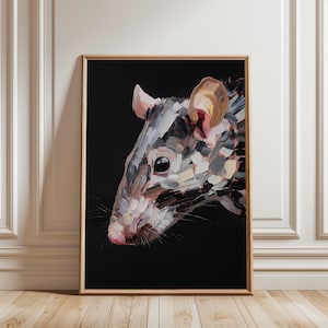 May include: A framed artwork featuring a close-up of a rat's head. The painting uses a palette of gray, pink, and brown brushstrokes against a black background. The rat's eye is dark, and whiskers are visible. The artwork is displayed in a room with white paneling and a wooden floor.