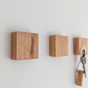 Handmade oak wood key rack – invisible magnets for stylish hallway or office key storage.