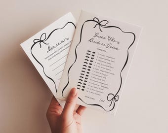May include: Two white rectangular wedding game cards with black ink. One card features the text Guess Who Bride or Groom with a list of 14 questions and mustache or lip icons. The other card is titled Memories with lines for writing.