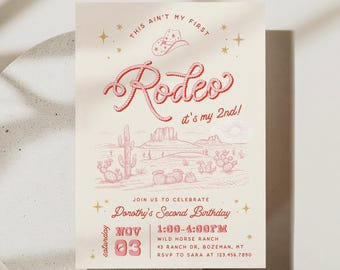 May include: A cream-colored birthday invitation card featuring red text and illustrations. The text reads: This ain't my first Rodeo, it's my 2nd! Join us to celebrate Dorothy's Second Birthday, Saturday Nov 03, 1:00-4:00PM, Wild Horse Ranch.