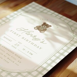 May include: A light green and white gingham patterned invitation with the text "Henry's First Birthday". The invitation features a watercolor illustration of a teddy bear and event details.