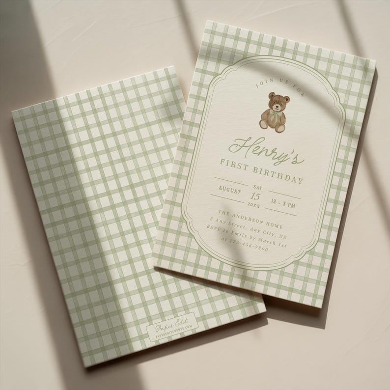 May include: Two baby shower invitations. The invitations have a light green gingham pattern. One invitation has a decorative border with a teddy bear illustration and the text "Henry's First Birthday".