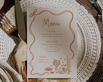 May include: A rectangular menu card with a wavy orange border and line art illustrations of a pumpkin, candles, and flowers. The text reads Menu, Entree, Herb Roasted Turkey Breast, Brown Sugar Glazed Ham, Side Dishes, Whipped Mashed Potatoes, Creamed Corn, Fresh Cut Asparagus, Cranberry Relish, Dessert, Pumpkin Pie, Apple Crisp.