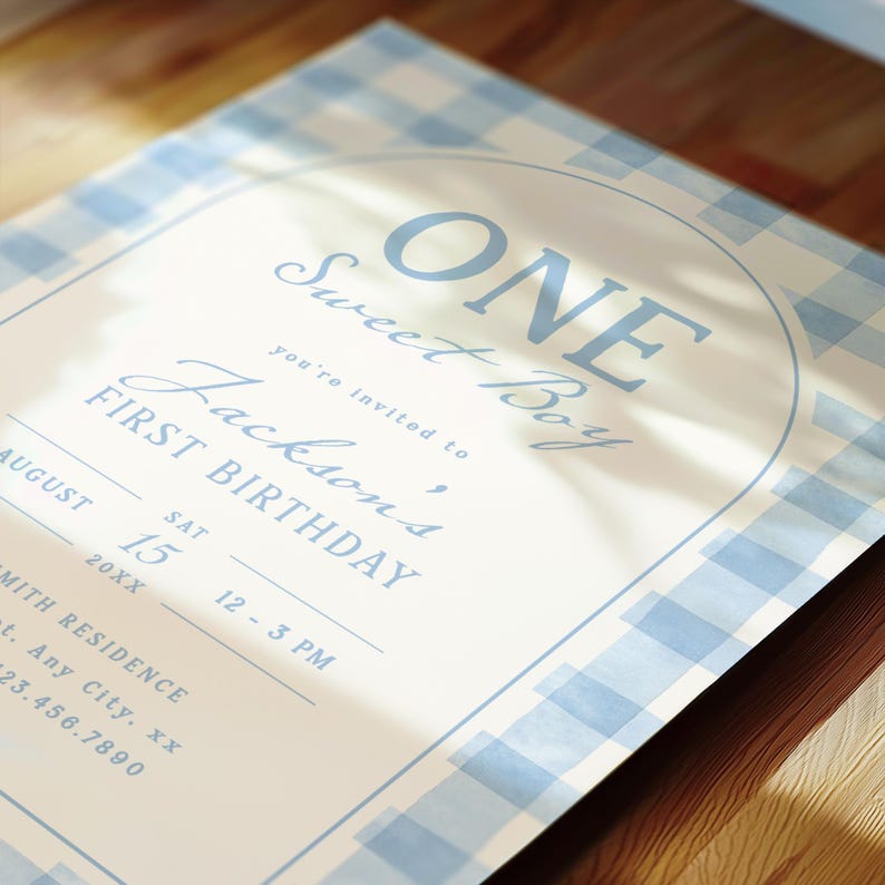 May include: A light blue and white gingham patterned invitation with the text "ONE Sweet Boy" and "Jackson's FIRST BIRTHDAY". The invitation includes the date, time, and location details.