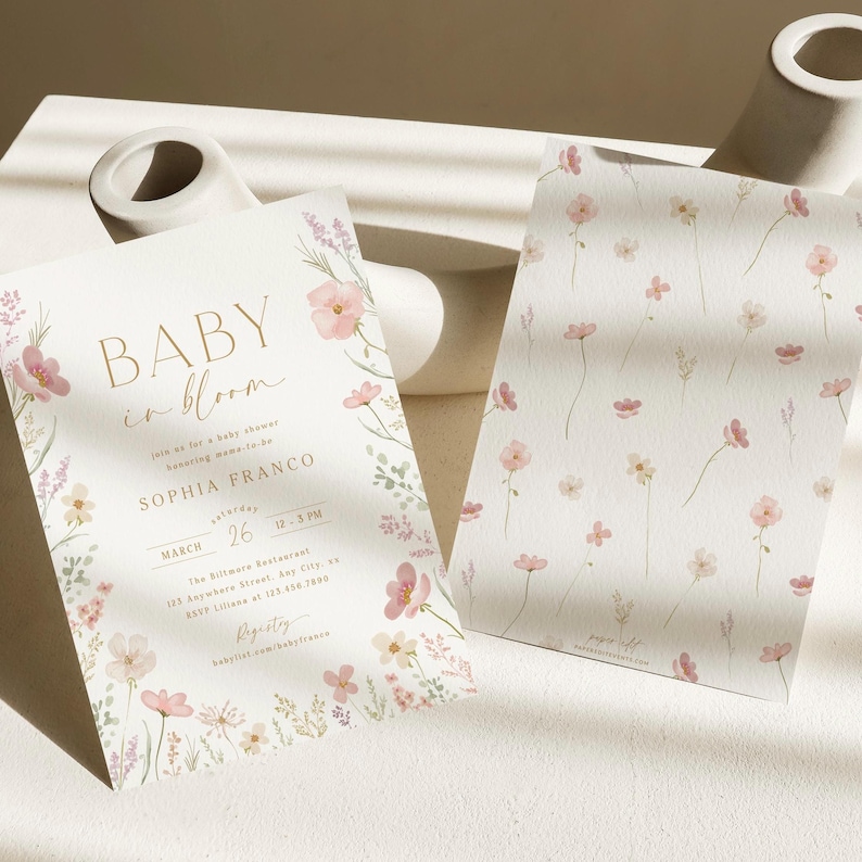 May include: A baby shower invitation with a floral design. The invitation is for Sophia Franco and is set for March 26th at 1-3 PM. The text "Baby in Bloom" is written in gold script.