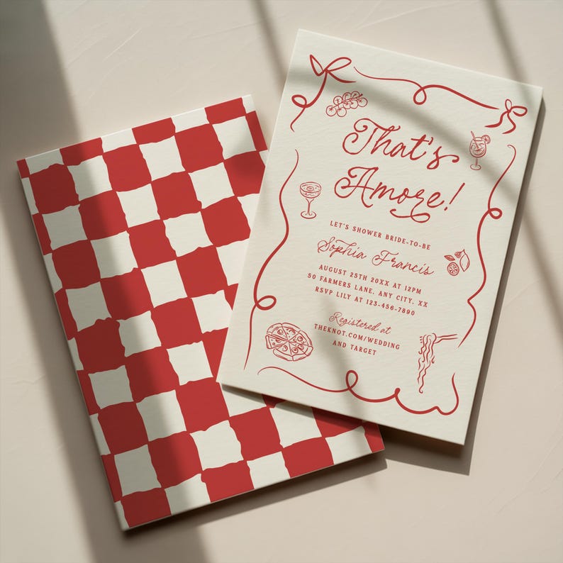 May include: Two invitation cards. One features a red and white checkered pattern. The other has the text "That's Amore!" in red, along with illustrations of food and drinks. The invitation is for a bridal shower.