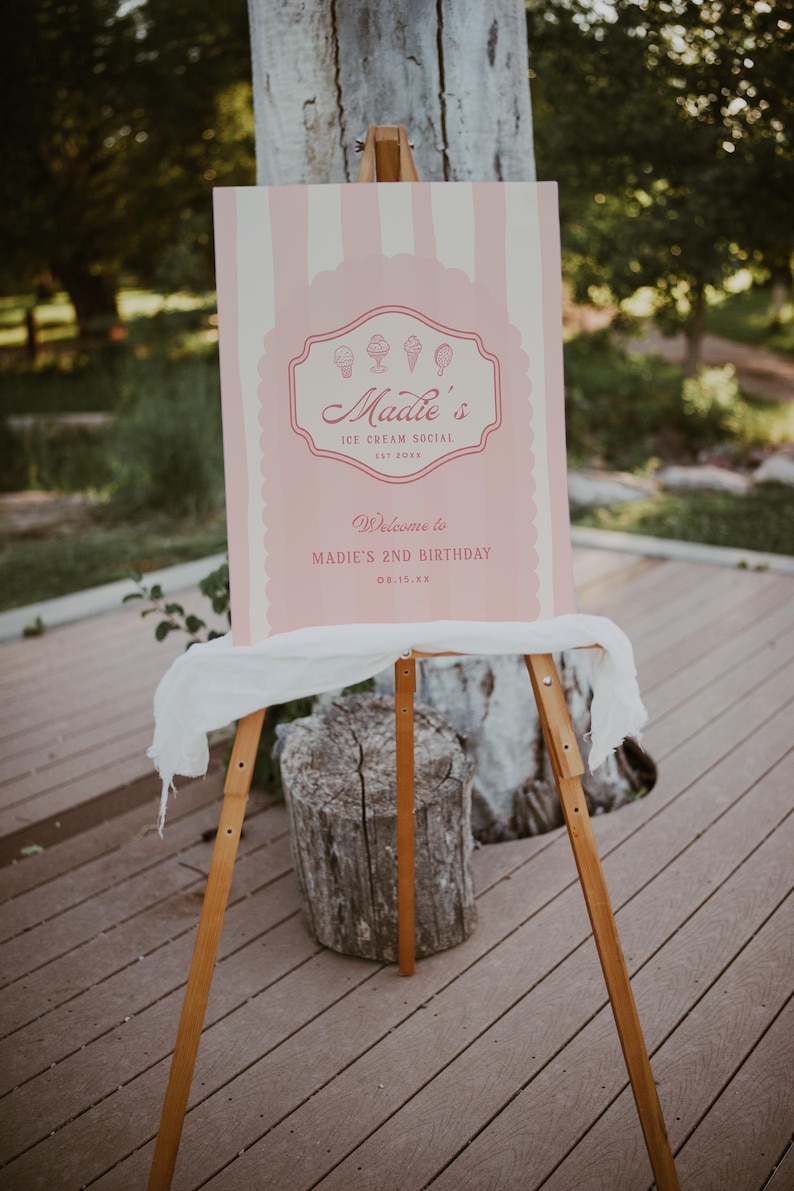 May include: Pink and white striped sign with the text "Maddie's Ice Cream Social Est. 20XX" and "Welcome to Maddie's 2nd Birthday 08.15.XX".