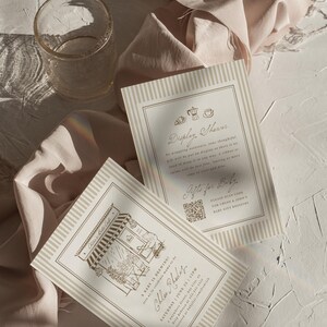 May include: Two rectangular cream-colored cards with beige vertical stripes. One card features a cafe illustration and text reading A Baby is Brewing, Chloe Rhodes, Saturday June 25, 12PM. The other card reads Display Shower and Gifts for Baby.