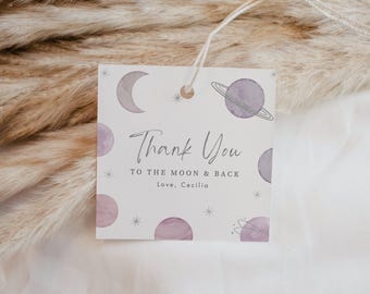 May include: A square white gift tag with a string, featuring purple watercolor planets, a crescent moon, and small stars. The text reads: Thank You TO THE MOON & BACK Love, Cecilia. The design includes celestial motifs in shades of purple.
