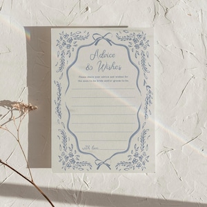 May include: A rectangular card with the text "Advice & Wishes" in elegant script, framed by a light blue floral border. The card includes lines for writing advice and wishes, with the phrase "with love" at the bottom.