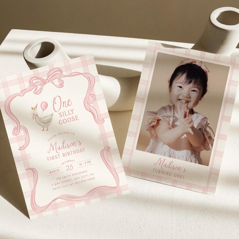 May include: Pink and white birthday invitations with a photo and text. One invitation features a cartoon goose and the words "One Silly Goose." The other invitation has a photo of a smiling child and the words "Madison's Turning One!"