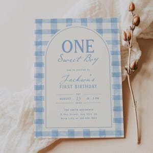 May include: A light blue and white gingham patterned invitation for a first birthday. The text reads "ONE Sweet Boy" above "Jackson's FIRST BIRTHDAY". Details include date, time, and RSVP information.