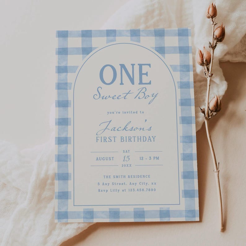 May include: A light blue and white gingham patterned invitation for a first birthday. The text reads "ONE Sweet Boy" above "Jackson's FIRST BIRTHDAY". Details include date, time, and RSVP information.