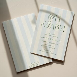 May include: Baby shower invitations with a light blue and white striped pattern. The text "OH BABY!" is in a script font, with details for Chloe Franco's baby shower. Includes RSVP information and registry details.