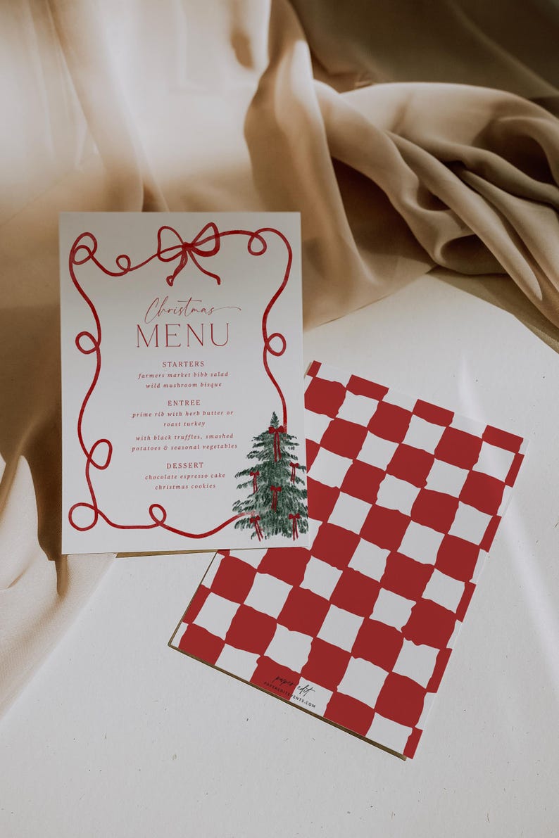 May include: A Christmas menu card with a red bow design and the words "Christmas MENU". The menu includes starters, entrees, and dessert options. A red and white checkered card is next to the menu.