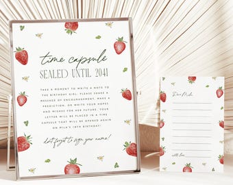May include: A white time capsule sign and matching note card decorated with watercolor strawberries and small flowers. The sign reads: time capsule SEALED UNTIL 2041, with instructions for a birthday girl, and the note card says Dear Mila.