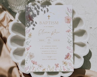 May include: A baptism invitation with a floral design in shades of pink, white, and green. The invitation features a gold cross and the text "Join us for the Baptism of our daughter Olivia Rose" with the date and time of the event. The invitation also includes the location of the ceremony and reception.