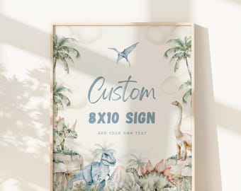 May include: A customizable 8x10 inch sign with a dinosaur theme. The sign features a blue and green dinosaur, a pterodactyl, and palm trees on a white background. The text "Custom 8x10 Sign" and "Add your own text" is printed on the sign.