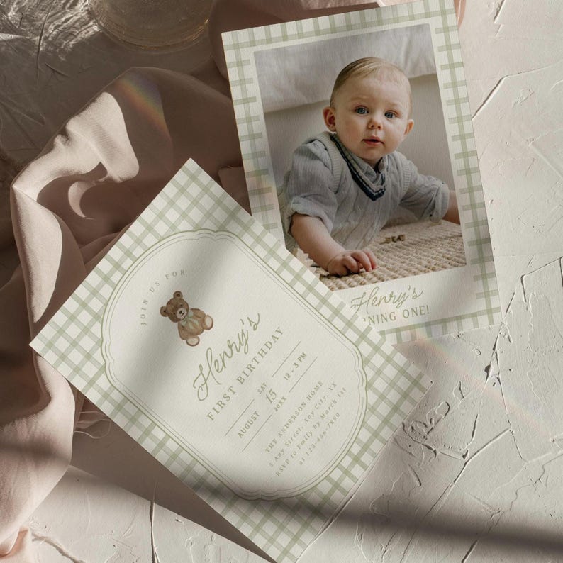May include: Two baby's first birthday invitations with a gingham pattern in green and white. One invitation features a photo of a baby, and the other has a teddy bear graphic. The text reads "Henry's First Birthday" and includes date and time.