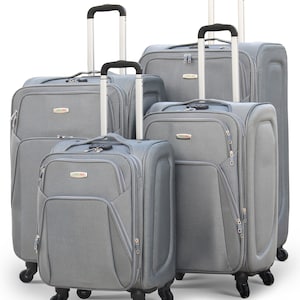 May include: Set of four grey suitcases with black handles and wheels. The suitcases are arranged in size order, with the largest suitcase at the back and the smallest suitcase at the front.