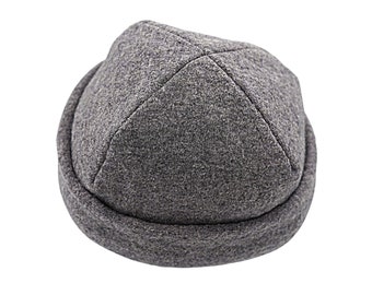 May include: A gray wool beanie with a rounded crown and a folded brim.