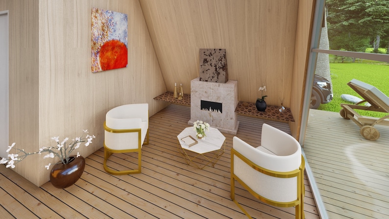 May include: A modern living room with two white chairs with gold frames, a white coffee table with a gold frame, and a fireplace with a stone surround. The room has wood floors and large windows.