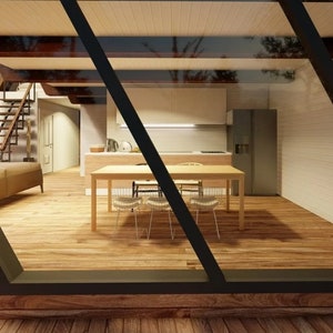 May include: A view through a window of a modern kitchen with a wooden table and four chairs. The kitchen has white cabinets and a stainless steel refrigerator.