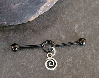 May include: Black industrial barbell with a silver spiral charm hanging from it.