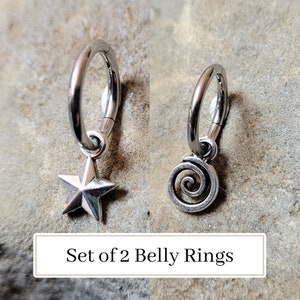 May include: Set of two silver belly rings with a star and a spiral charm.  The rings are made of surgical steel and are perfect for everyday wear.