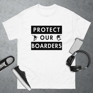 May include: White t-shirt with black text that reads "PROTECT OUR BOARDERS" with two silhouettes of skateboarders in the middle of the text.
