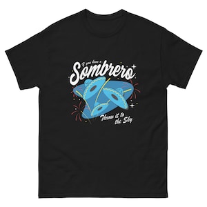 May include: Black t-shirt with a retro design featuring a blue sombrero with the text "If you have a Sombrero Throw it to the Sky".