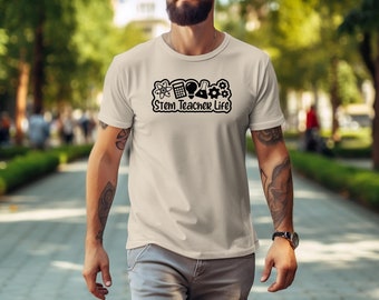 May include: A beige t-shirt with a black graphic of science icons and the text "Stem Teacher Life".