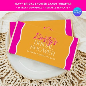 May include: A yellow and pink candy bar wrapper with the text "Kirsty's Bridal Shower" and "Saturday June 27th 20XX".
