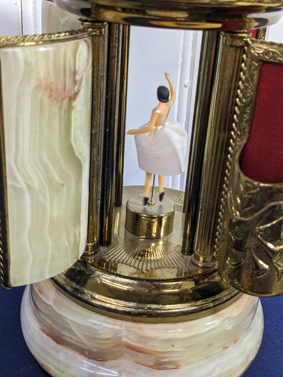 reuge vintage cigarette lipstick holder carousel music box SOLD This is a in Capodimonte style. This rare edition is absolutely stunning, just look at those wonderful details! This model is hand-painted and Vintage Swiss Reuge Dancing Ballerina