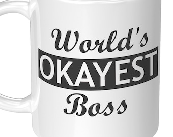 May include: White ceramic mug with black text that reads "World's Okayest Boss".