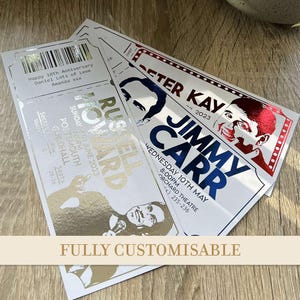 May include: Customisable event tickets with gold and silver foil detailing. The tickets feature the names "Russell Howard", "Peter Kay", and "Jimmy Carr", along with event details and the text "Happy 10th Anniversary".