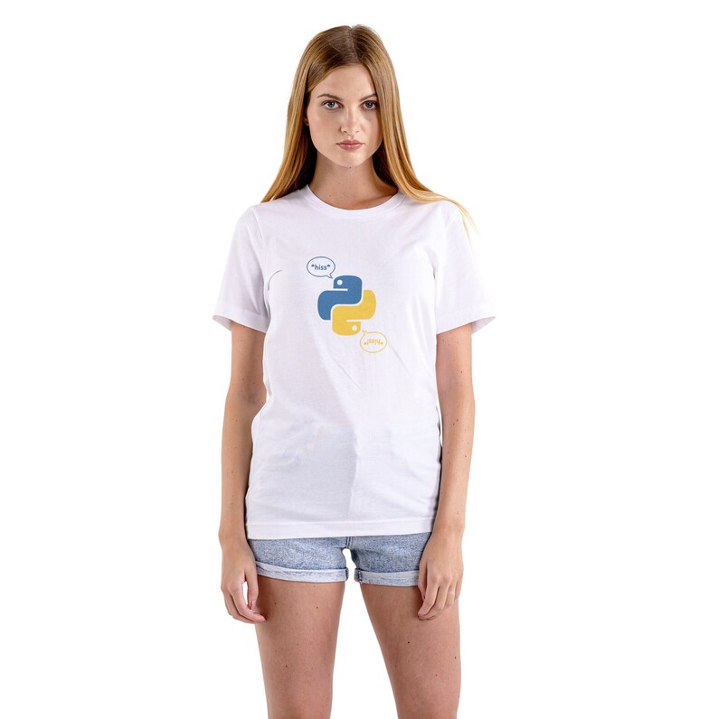 May include: White t-shirt featuring a blue and yellow Python logo with speech bubbles. The speech bubbles say "hiss" and "ssss". The shirt is a classic crew neck style.