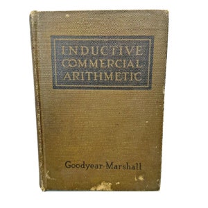 May include: A vintage green book titled "Inductive Commercial Arithmetic" by Goodyear Marshall.