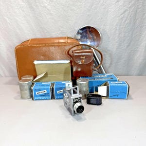 1949 Universal Minute 16 Mini Camera with 2 Rolls Film, Flash, Canisters, Cases
