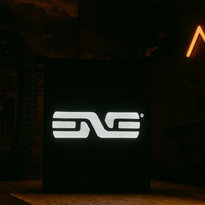 May include: A black box with a glowing white logo. The logo is a stylized design of the letters "ENVE". The background is dark, with hints of wood and neon lights.