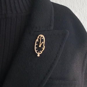 Broche de relógio de ouro com zircônia cúbica