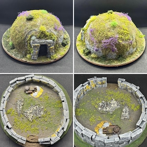 May include: A miniature diorama of a stone structure with a domed roof covered in green moss and purple vegetation. The structure features a stone entrance and an interior floor with stone walls, scattered skeletal remains, and small metal crates.