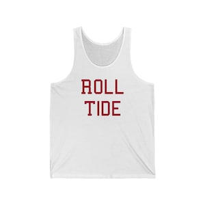 May include: White tank top with the words "ROLL TIDE" printed in maroon.