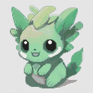 Peut inclure: Une créature de dessin animé verte et blanche avec de grands yeux et un large sourire. La créature a une queue feuillue et une tête feuillue.