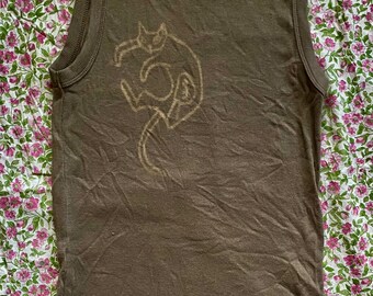 May include: A brown sleeveless tank top with a white outline of a cat on the front.